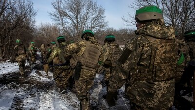 Russia-Ukraine War: Ukrainian servicemen walk on a road outside the frontline town of Bakhmut, amid Russia's attack on Ukraine, in Donetsk region. (Reuters)
