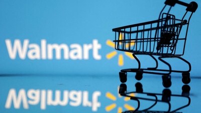 FILE PHOTO: Shopping trolley is seen in front of Walmart logo in this illustration. (REUTERS)