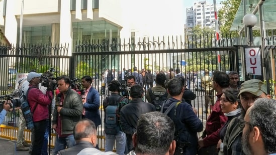 Media personnel outside the BBC office amid a survey operation conducted by Income Tax Department officials as part of a tax evasion investigation at KG Marg in New Delhi on Tuesday, (PTI)