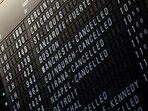 A flight schedule board shows cancelled Lufthansa flights after an IT fault at Germany’s Lufthansa causes massive flight delays and disruptions in Frankfurt.