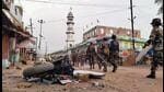 Security personnel patrol after a clash between two groups at Panki, in Palamu district on Wednesday. (PTI)