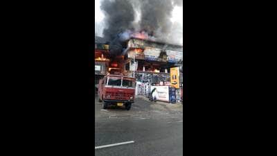 A fire tender trying to douse the fire that broke out in a timber depot and spread to the adjoining multi-storeyed building at Bithal village in the Kumarsein sub division of Shimla district on Wednesday. (HT Photo) A fire tender trying to douse the fire that broke out in a timber depot and spread to the adjoining multi-storeyed building at Bithal village in the Kumarsein sub division of Shimla district on Wednesday. (HT Photo)
