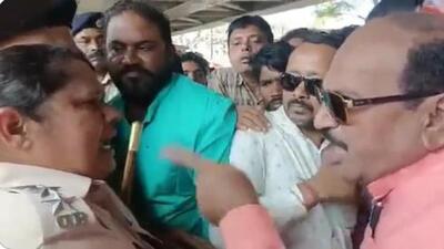 A video of the alleged scuffle between Jaynarayan Mishra and a woman police inspector in Odisha has gone viral on social media. (Video grab) A video of the alleged scuffle between Jaynarayan Mishra and a woman police inspector in Odisha has gone viral on social media. (Video grab)