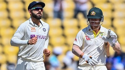 India's Virat Kohli (L) runs past Australia's David Warner during the third day of the first Test cricket match between India and Australia at the Vidarbha Cricket Association (VCA) Stadium in Nagpur on February 11, 2023. (Photo by Indranil MUKHERJEE / AFP) / IMAGE RESTRICTED TO EDITORIAL USE - STRICTLY NO COMMERCIAL USE (AFP) India's Virat Kohli (L) runs past Australia's David Warner during the third day of the first Test cricket match between India and Australia at the Vidarbha Cricket Association (VCA) Stadium in Nagpur on February 11, 2023. (Photo by Indranil MUKHERJEE / AFP) / IMAGE RESTRICTED TO EDITORIAL USE - STRICTLY NO COMMERCIAL USE (AFP)
