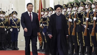 In this photo provided by China's Xinhua News Agency,In this photo released by Xinhua News Agency, Visiting Iranian President Ebrahim Raisi, right, and Chinese President Xi Jinping review an honor guard during a welcome ceremony at the Great Hall of the People in Beijing, Tuesday, Feb. 14, 2023. Chinese leader Xi Jinping expressed support for Iran during a visit by its president on Tuesday as Tehran tries to expand relations with Beijing and Moscow to offset Western sanctions over its nuclear development. (Pang Xinglei/Xinhua via AP)/Xinhua via AP) (AP)