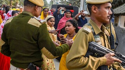 A policeman outside Mayong police station in Morigaon district speaks with relatives of people arrested during Assam government's state crackdown on child marriages. (PTI) A policeman outside Mayong police station in Morigaon district speaks with relatives of people arrested during Assam government's state crackdown on child marriages. (PTI)