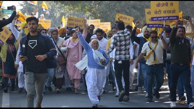 Over 400 members of AAP Haryana on Wednesday held a protest in Panchkula seeking immediate removal of minister Sandeep Singh, an accused in sexual harassment case, from the state ministry and sought strict action against him. (Sant Arora/HT)