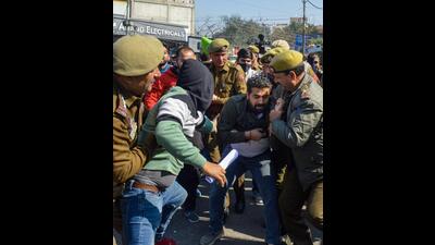 Protesting Kashmiri Pandits being detained by policemen in Jammu on Wednesday. (PTI)