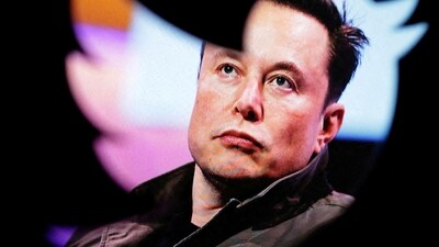 Elon Musk: Elon Musk's photo is seen through a Twitter logo in this illustration. (Reuters)
