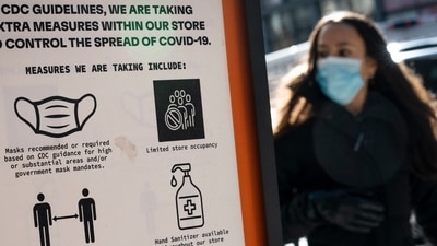 Pedestrians wearing protective masks walk along West Broadway in the SoHo district of New York City, Friday, March 4, 2022, in New York. (AP) Pedestrians wearing protective masks walk along West Broadway in the SoHo district of New York City, Friday, March 4, 2022, in New York. (AP)