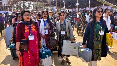 Women poll officials head towards their respective polling stations for the Tripura Assembly elections, in Agartala. (PTI) Women poll officials head towards their respective polling stations for the Tripura Assembly elections, in Agartala. (PTI)