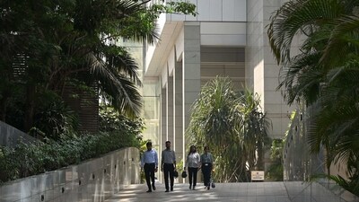 Office goers walk out of an office complex housing the BBC offices and studio in Mumbai. (AFP) Office goers walk out of an office complex housing the BBC offices and studio in Mumbai. (AFP)