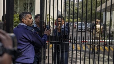 Private security guards close the gate of a building housing BBC office in New Delhi, India, Tuesday, (AP)