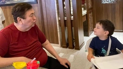 Randhir Kapoor playing with Jehangir. Randhir Kapoor playing with Jehangir.