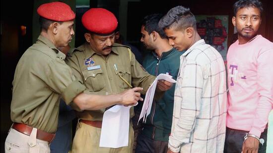Assam Police arrest an accused in a child marriage case, in Guwahati on Friday. (ANI)