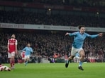 Manchester City's Jack Grealish celebrates after scoring his side's second goal during the English Premier League soccer match between Arsenal and Manchester City at the Emirates stadium in London, England, Wednesday, Feb.15, 2023. (AP Photo/Kin Cheung) Manchester City's Jack Grealish celebrates after scoring his side's second goal during the English Premier League soccer match between Arsenal and Manchester City at the Emirates stadium in London, England, Wednesday, Feb.15, 2023. (AP Photo/Kin Cheung)