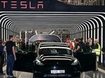 Elon Musk hands over a Model Y car to a customer during the opening ceremony of the new Tesla Gigafactory in Gruenheide, Germany in 2022. (REUTERS/File Photo)