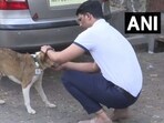 Mumbai-based engineer Akshay Ridlan with a street dog. Mumbai-based engineer Akshay Ridlan with a street dog.