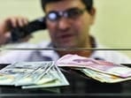 Currency seen at a forex bureau counter in New Delhi. Currency seen at a forex bureau counter in New Delhi.