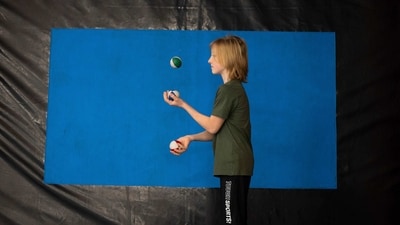 A Ukrainian refugee circus student practices juggling in a training room in Budapest, Hungary. Capital Circus of Budapest director Peter Fekete told AP, "If we provide an opportunity to train, and if we set goals that we want to achieve through opportunities to perform, then in their everyday lives they won’t be focused only on the difficult situation they are in, but artistic performance can fill their lives to some degree,” (Denes Erdos / AP) A Ukrainian refugee circus student practices juggling in a training room in Budapest, Hungary. Capital Circus of Budapest director Peter Fekete told AP, "If we provide an opportunity to train, and if we set goals that we want to achieve through opportunities to perform, then in their everyday lives they won’t be focused only on the difficult situation they are in, but artistic performance can fill their lives to some degree,” (Denes Erdos / AP)