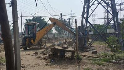 A Ludhiana MC team demolishing illegal under-construction buildings in Zone D. (HT File)