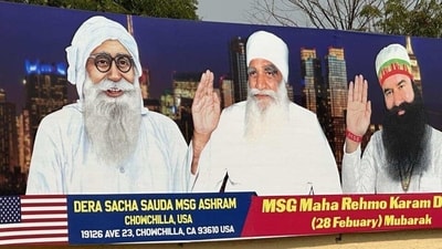 A poster outside the Dera Sacha Sauda headquarters in Sirsa with portraits of founder Mastana Balochistani, his successor Satnam Singh and Gurmeet Ram Rahim Singh, who heads the sect since 1990. Gurmeet Ram Rahim, convicted of rape and involved in two murder cases, is out on parole from Sunaria Jail in Rohtak. (HT Photo) A poster outside the Dera Sacha Sauda headquarters in Sirsa with portraits of founder Mastana Balochistani, his successor Satnam Singh and Gurmeet Ram Rahim Singh, who heads the sect since 1990. Gurmeet Ram Rahim, convicted of rape and involved in two murder cases, is out on parole from Sunaria Jail in Rohtak. (HT Photo)