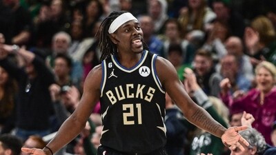 Feb 14, 2023; Milwaukee, Wisconsin, USA; Milwaukee Bucks guard Jrue Holiday (21) reacts after scoring a basket in the fourth quarter during game against the Boston Celtics at Fiserv Forum. Mandatory Credit: Benny Sieu-USA TODAY Sports (USA TODAY Sports)