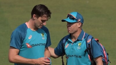 Australia's captain Pat Cummins (L) and his teammate David Warner take part in a practice session at the Arun Jaitley Stadium in New Delhi. (AFP) Australia's captain Pat Cummins (L) and his teammate David Warner take part in a practice session at the Arun Jaitley Stadium in New Delhi. (AFP)