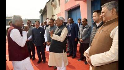 Chief minister Nitish Kumar greets outgoing Bihar Governor Phagu Chauhan at Jaiprakash Narayan Airport in Patna on Thursday. (Santosh Kumar/HT Photo)