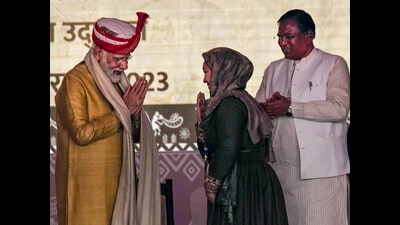 Prime Minister Narendra Modi exchanges greetings with a woman who presented a shawl to him during the inauguration of 'Aadi Mahotsav' - National Tribal Festival, at Major Dhyan Chand National Stadium, in New Delhi, on Thursday. (PTI) Prime Minister Narendra Modi exchanges greetings with a woman who presented a shawl to him during the inauguration of 'Aadi Mahotsav' - National Tribal Festival, at Major Dhyan Chand National Stadium, in New Delhi, on Thursday. (PTI)