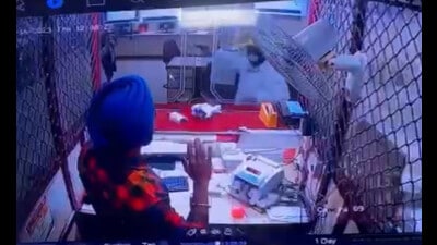 The incident took place at around 12:30 pm when the bank branch staff was dealing with the customers. (Video Grab)