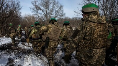 Russia-Ukraine War: Ukrainian servicemen walk on a road outside the frontline town of Bakhmut, amid Russia's attack on Ukraine, in Donetsk region. (Reuters)