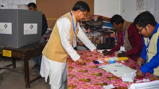 Tripura Chief Minister Manik Saha gets his finger marked with indelible ink before casting his vote at a polling booth during the Tripura Assembly elections, in Agartala.(PTI)