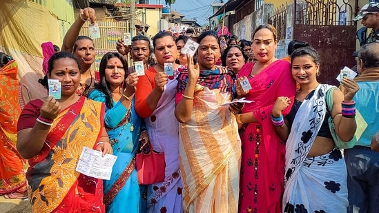 Transgender voters show their identification cards at a polling booth during the Tripura Assembly elections, at Pratapgarh in West Tripura district.(PTI)