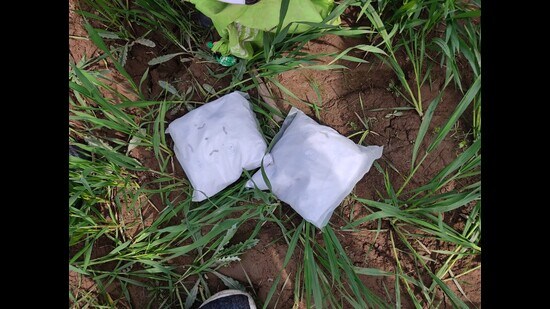 The BSF officials said the heroin is believed to be smuggled through a drone from across the border. (HT Photo)