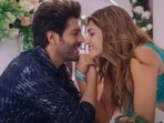 Kartik Aaryan and Kriti Sanon in a still from Shehzada. Kartik Aaryan and Kriti Sanon in a still from Shehzada.