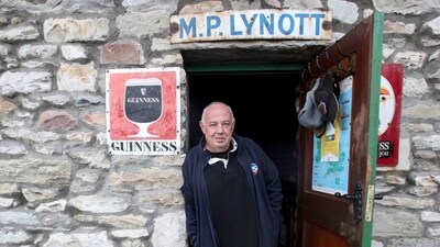 Owner of the Lynotts pub, Mick Lynch, seen at the Purteen harbour, one of the filming locations of the movie, on January 31. Usually a working fisherman's wharf, it became the location for a portside street scene with a 1920s shopfront. The pub, where much of the film's action takes place, was built from scratch atop windswept cliffs on Achill's southwest coast, AFP reported. (Paul Faith / AFP) Owner of the Lynotts pub, Mick Lynch, seen at the Purteen harbour, one of the filming locations of the movie, on January 31. Usually a working fisherman's wharf, it became the location for a portside street scene with a 1920s shopfront. The pub, where much of the film's action takes place, was built from scratch atop windswept cliffs on Achill's southwest coast, AFP reported. (Paul Faith / AFP)