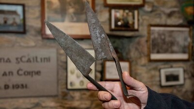 Mick Lynch, owner of Lynott's Pub on Achill, explained that visitors had already begun inquiring about the film. Among the souvenirs lining the pub's walls are what Lynch calls the movie's "infamous" shears, used by Gleeson's character to chop off his own fingers. Lynch said his tiny pub -- a dry stone wall structure with a thatched roof built as a jail in the 16th century -- is a true-to-life version of the pub created for 'Banshees'. (Paul Faith / AFP) Mick Lynch, owner of Lynott's Pub on Achill, explained that visitors had already begun inquiring about the film. Among the souvenirs lining the pub's walls are what Lynch calls the movie's "infamous" shears, used by Gleeson's character to chop off his own fingers. Lynch said his tiny pub -- a dry stone wall structure with a thatched roof built as a jail in the 16th century -- is a true-to-life version of the pub created for 'Banshees'. (Paul Faith / AFP)