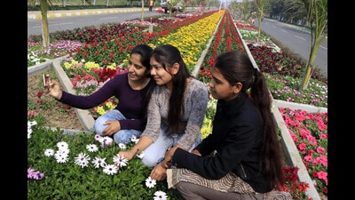 Girls taking selfies on the campus of Maharshi Dayanand University in Rohtak on Friday. Minimum temperatures settled above season’s normal levels at many places in Punjab and Haryana on Friday. (Manoj Dhaka /HT)