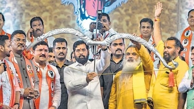 CM Eknath Shinde with the replica of bow and arrow during the Dussehra rally, at MMRDA Ground, Bandra-Kurla Complex (BKC), in Mumbai. (HT file photo) CM Eknath Shinde with the replica of bow and arrow during the Dussehra rally, at MMRDA Ground, Bandra-Kurla Complex (BKC), in Mumbai. (HT file photo)