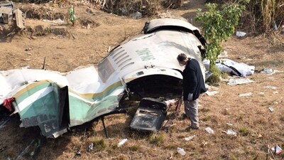 An investigator takes stalk of the wreckage of Yeti Airlines' flight. (REUTERS)