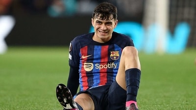 Barcelona's Spanish midfielder Pedri reacts after a fall during the UEFA Europa League round of 32 first-leg football match between FC Barcelona and Manchester United at the Camp Nou stadium in Barcelona, on February 16, 2023. (Photo by Josep LAGO / AFP) (AFP)