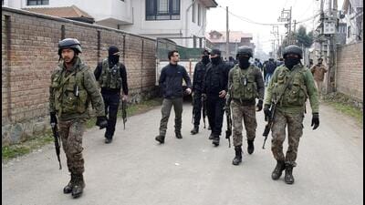 Security personnel patrol during the search operation after a gunshot-like sound was heard in the Qamarwari area of Srinagar on Thursday. (ANI)