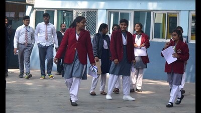 Students outside an exam centre in Prayagraj. (HT Photo) Students outside an exam centre in Prayagraj. (HT Photo)