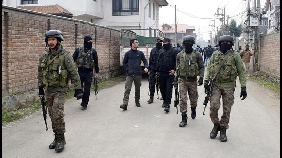 Security personnel patrol during the search operation after a gunshot-like sound was heard in the Qamarwari area of Srinagar on Thursday. (ANI)