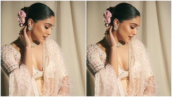 Sharvari picked an ivory white sequined blouse with long sleeves and a plunging neckline and teamed it with a matching long and flowy skirt featuring silver mirrorwork. In a georgette dupatta, she completed her look.&nbsp;(Instagram/@sharvari)