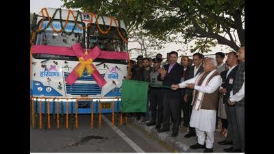 Haryana chief minister Manohar Lal Khattar flagging off the buses in Panchkula on Saturday. (HT Photo)