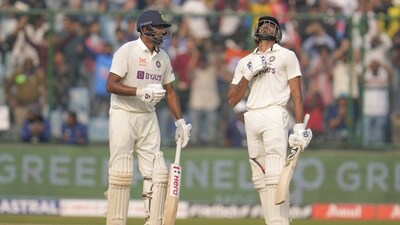 India's Axar Patel, right, looks up after he scored half century during the second day of the second cricket test match between India and Australia (AP) India's Axar Patel, right, looks up after he scored half century during the second day of the second cricket test match between India and Australia (AP)