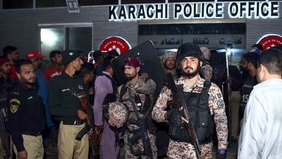 Paramilitary soldiers and police officers leave after conducting operation against attackers at a police headquarters, in Karachi, Pakistan, Friday. (AP) Paramilitary soldiers and police officers leave after conducting operation against attackers at a police headquarters, in Karachi, Pakistan, Friday. (AP)