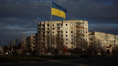 Spy Balloons In Ukraine: A Ukrainian national flag flutters near the buildings destroyed by Russian military strike, amid Russia's invasion of Ukraine, in the town of Borodianka, in Kyiv. (Reuters)